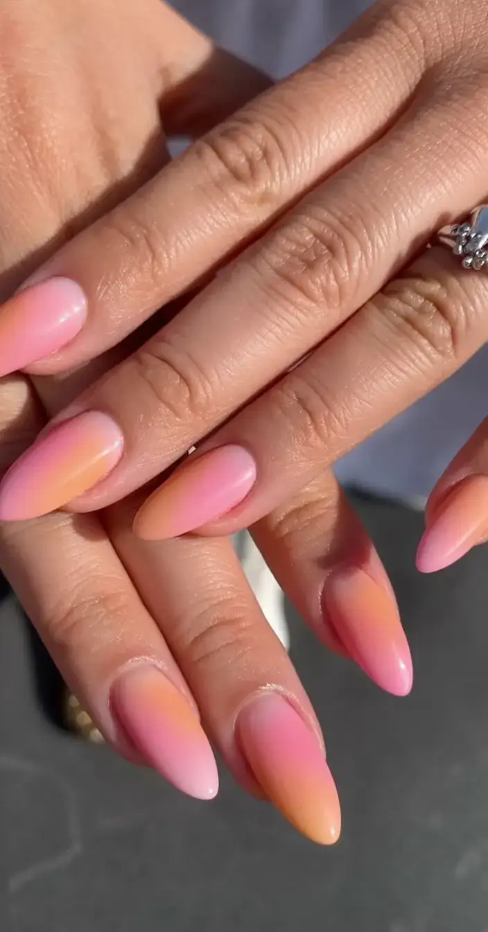 beautiful spring aura nails 2026 Peachy Pink Aura Ombre Nails with a Warm Glow
