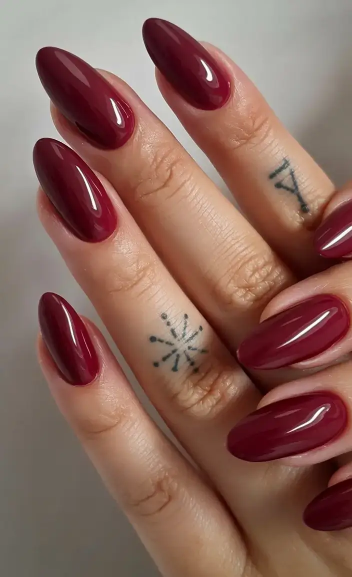beautiful spring aura nails 2026 Glossy Burgundy Almond Nails with Dramatic Depth