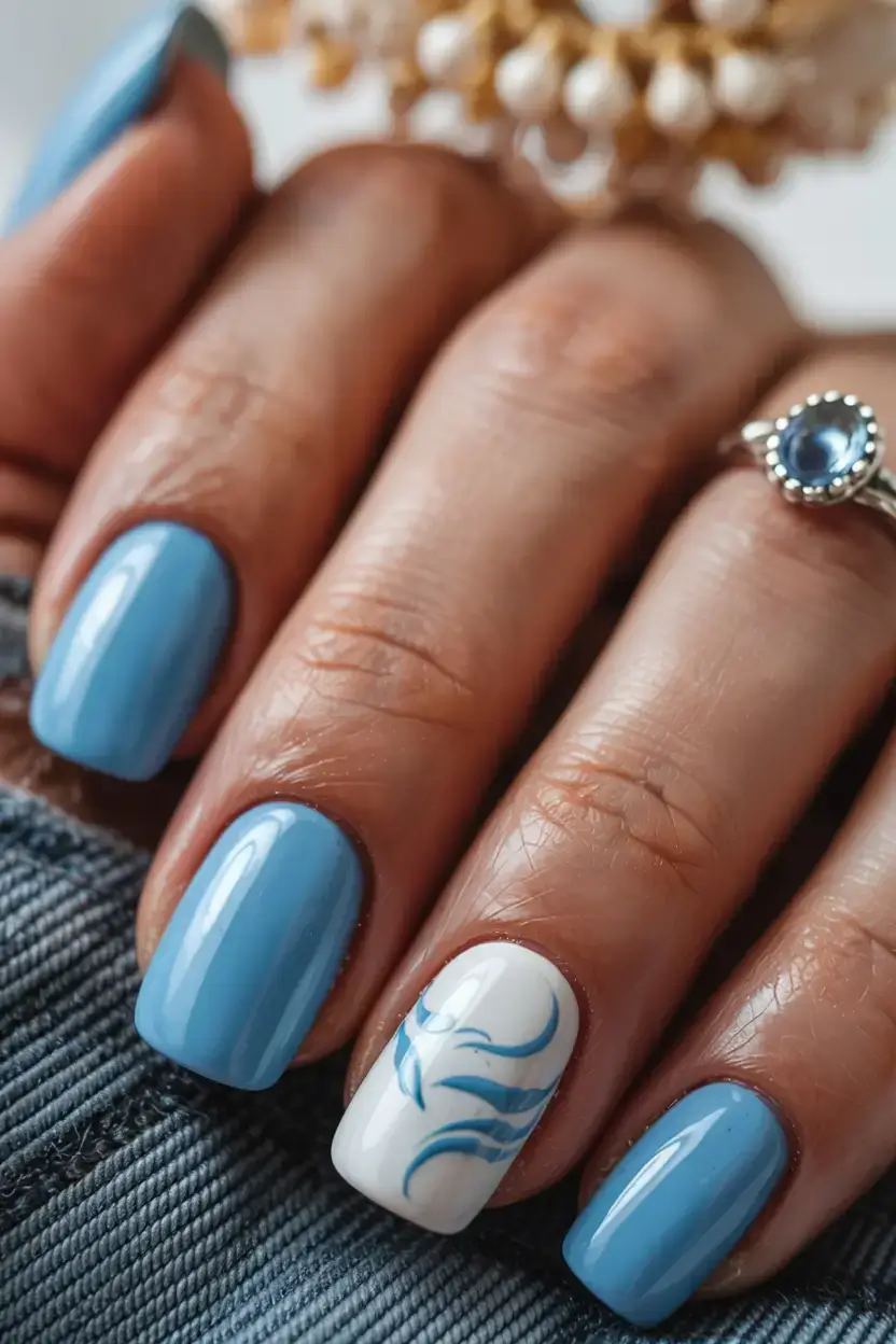 cute easy spring nail designs 2026 dusty blue nails with artistic accent