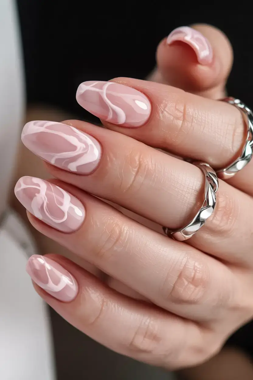 cute easy spring nail designs 2026 soft pink marble swirl manicure