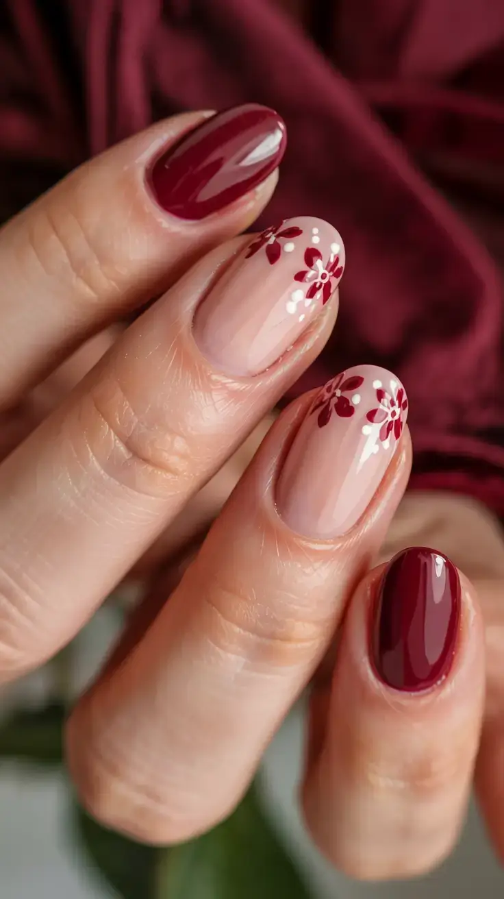 delicate spring oval nails 2026 Deep Berry Nails with Delicate Floral Detail