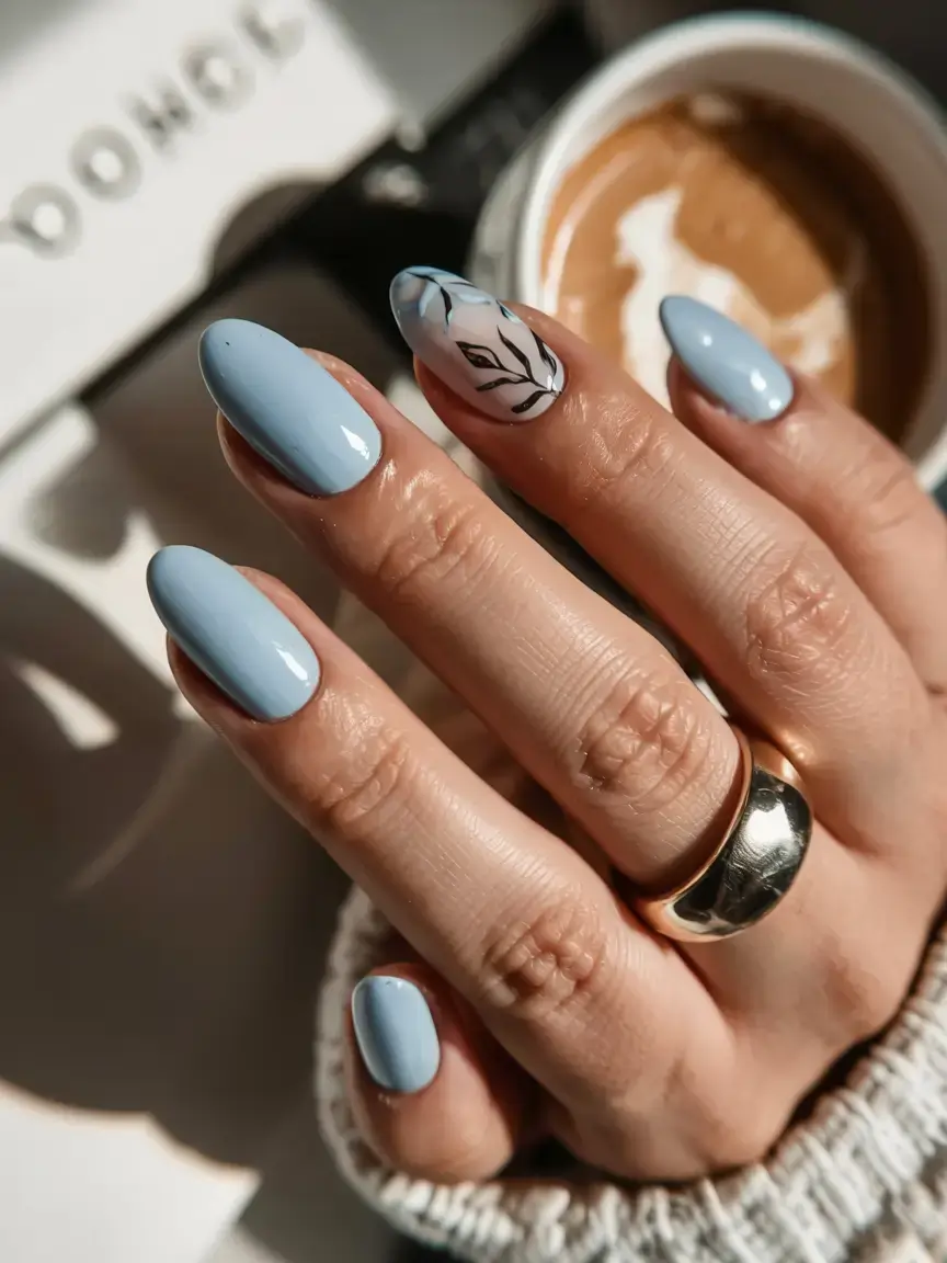 delicate spring oval nails 2026 Dusty Blue Oval Nails with Minimal Botanical Accent