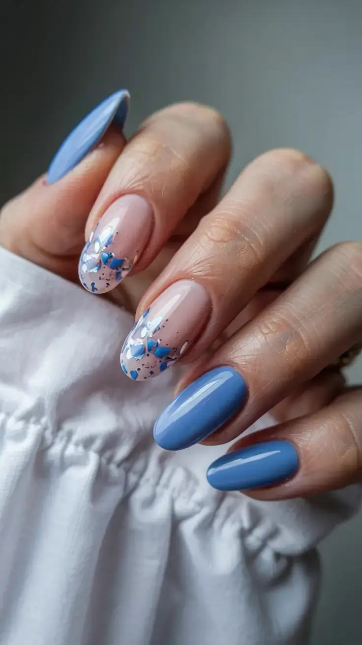 delicate spring oval nails 2026 Soft Blue Terrazzo Nails with Modern Texture