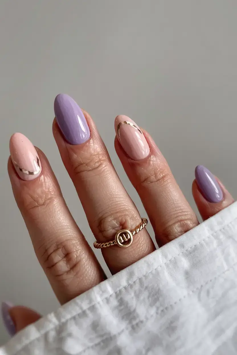 delicate spring oval nails 2026 Lavender and Nude Waves with Minimal Gold Accents