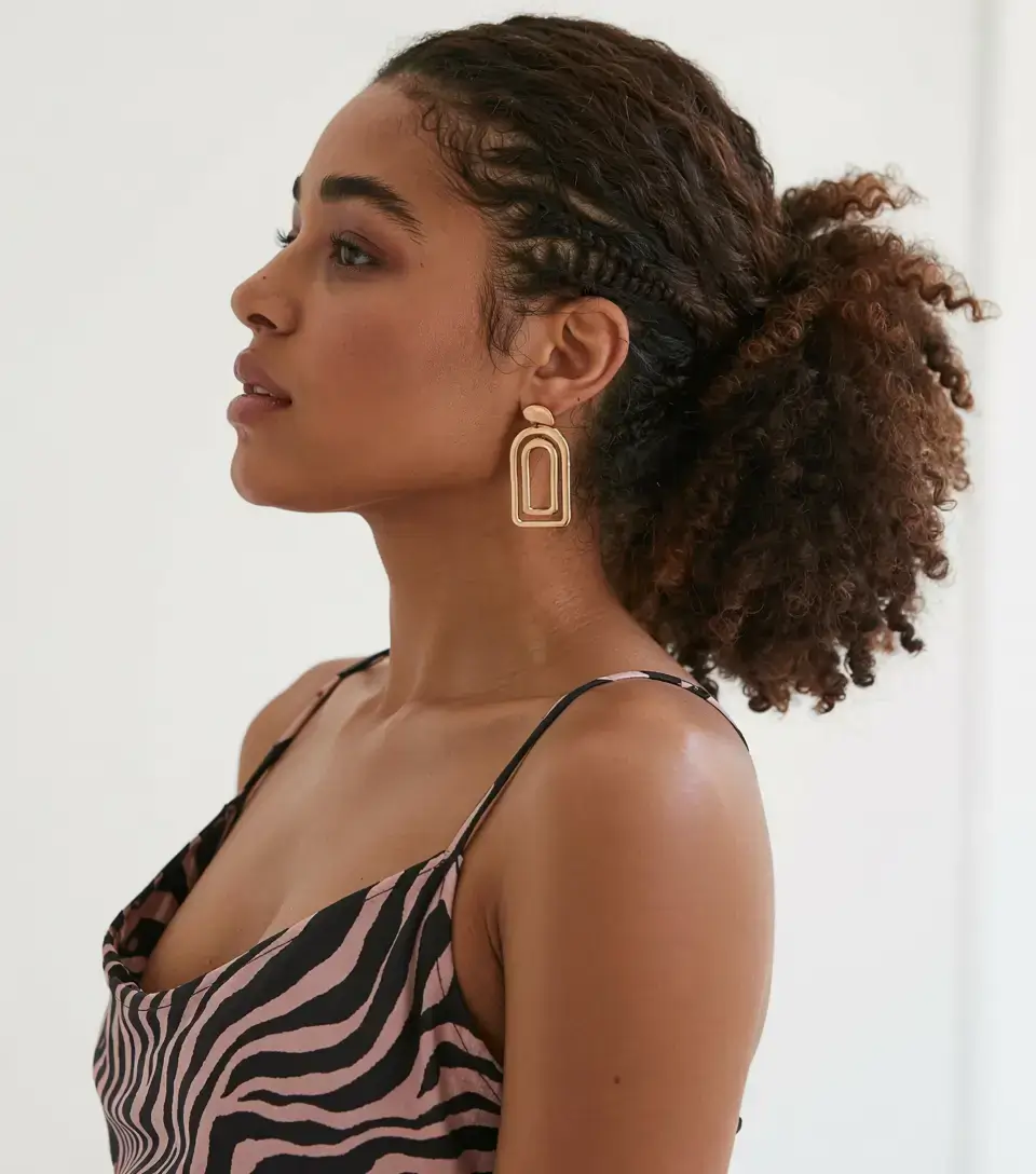 elegant spring natural hairstyle for 2026 curly ponytail with braids