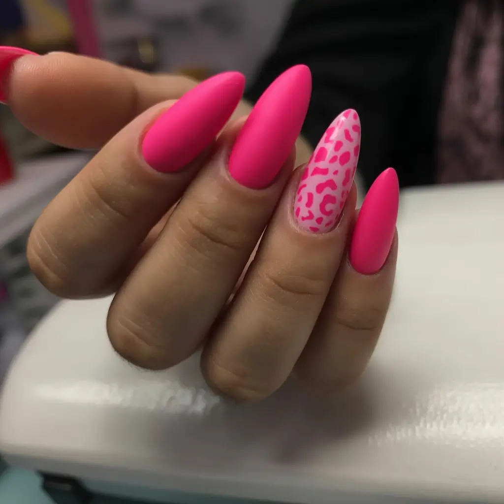 fresh spring hot pink nails 2026 Matte Hot Pink With a Playful Leopard Accent