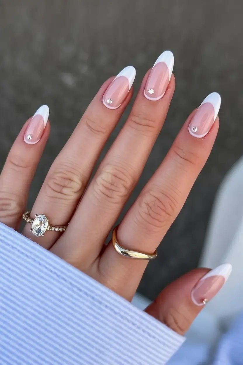 graduation nails ideas 2026 Classic French with a Single Crystal Accent