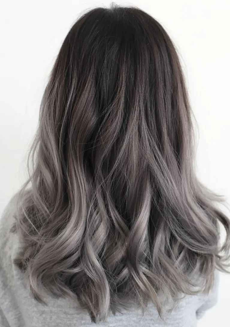 modern spring grey hair color ideas 2026 Smoky Grey Balayage with Soft Mid-Length Waves