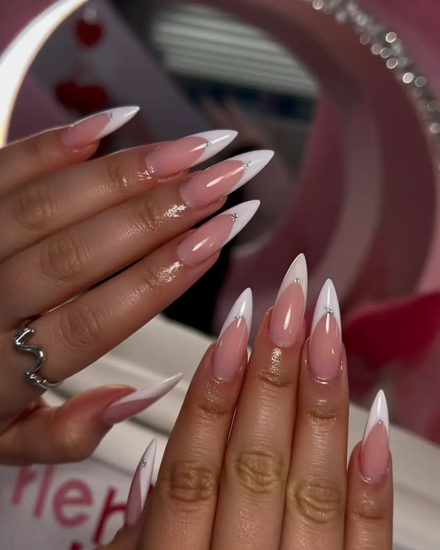 modern spring nails for brown skin 2026 White French Stiletto Nails
