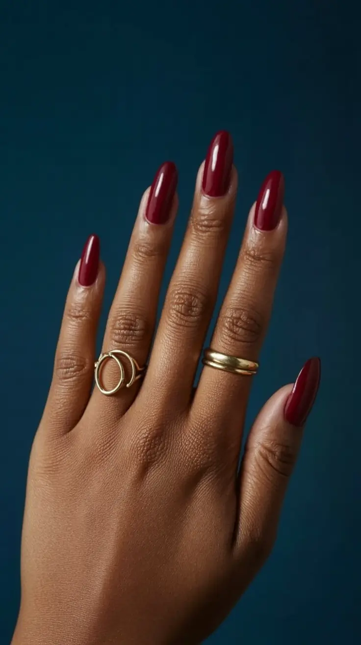 modern spring nails for brown skin 2026 Deep Red Almond Nails