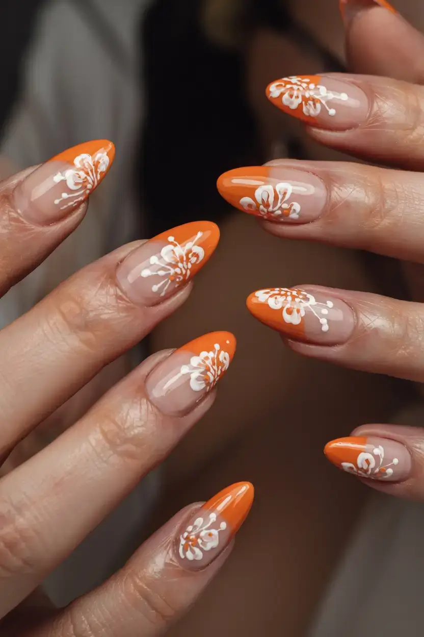 modern spring vacation nails 2026 Bright Tangerine Floral French Nails