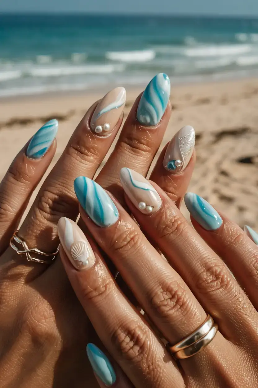 modern spring vacation nails 2026 Ocean Marble Nails with Pearls and Shell Accents
