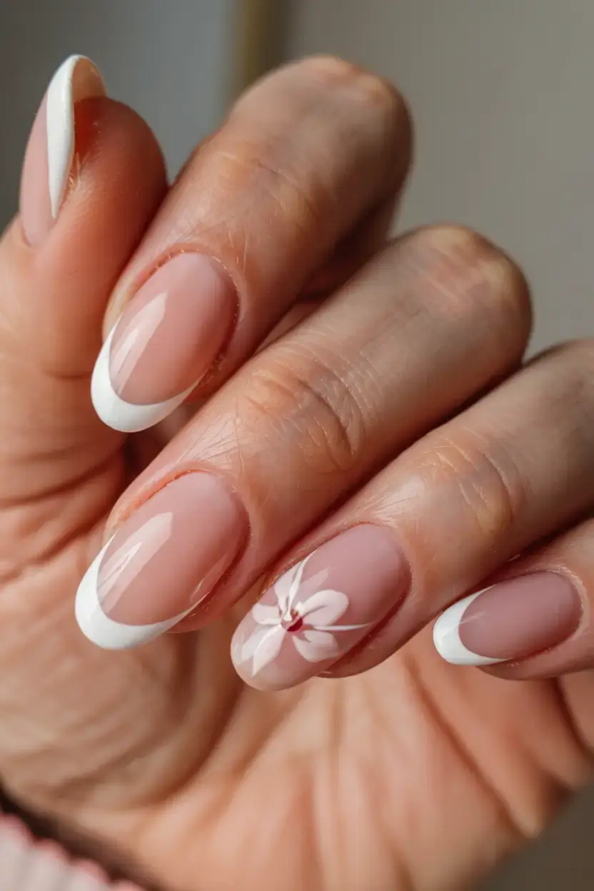 modern spring vacation nails 2026 Classic Soft French with Delicate Floral Detail