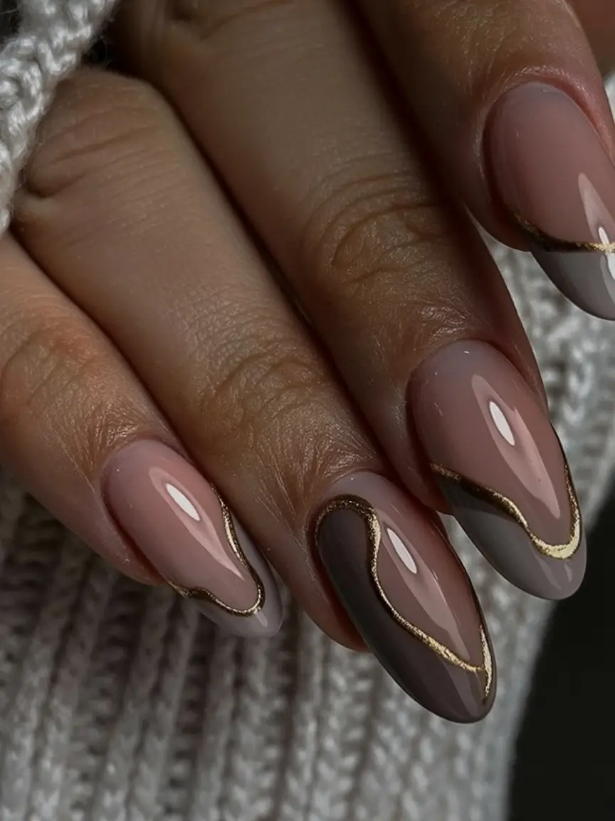 must try spring nails for dark skin 2026 Neutral Brown Marble Nails with Gold Detailing
