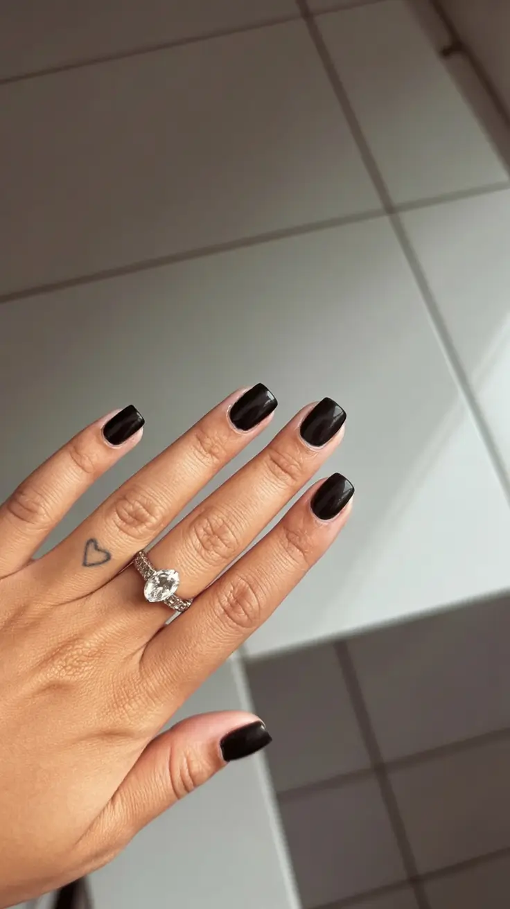 must try spring nails for dark skin 2026 Short Glossy Black Nails for Effortless Minimalism