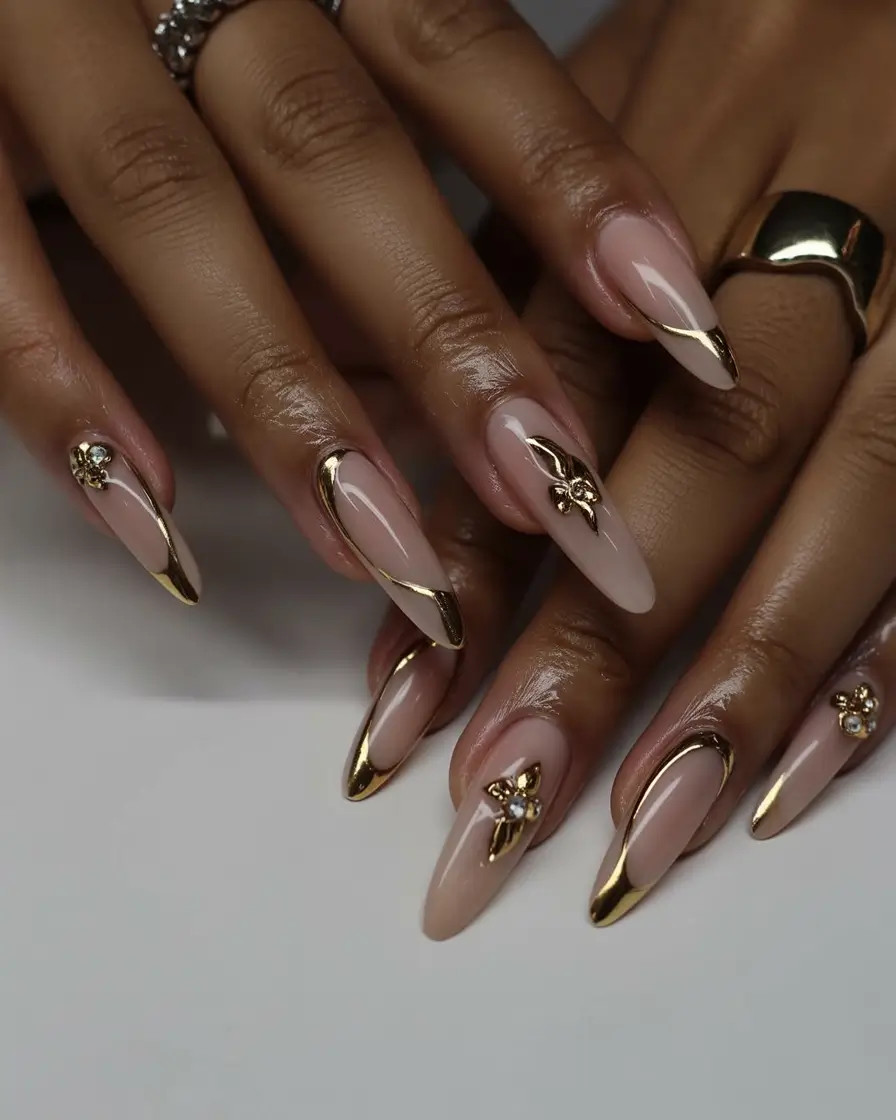 must try spring nails for dark skin 2026 Nude Almond Nails with Gold Sculpted Accents