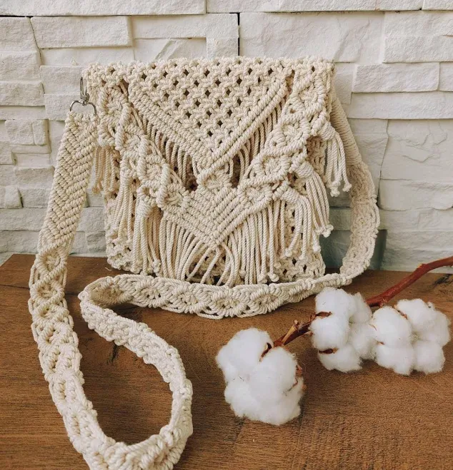 Woven macrame crossbody bag with tassel detail