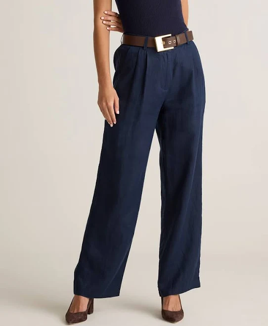 High-waisted wide-leg linen trousers with a subtle pleat
