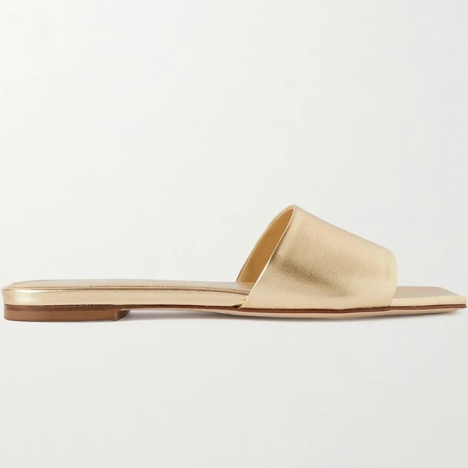 Flat gold metallic leather slides