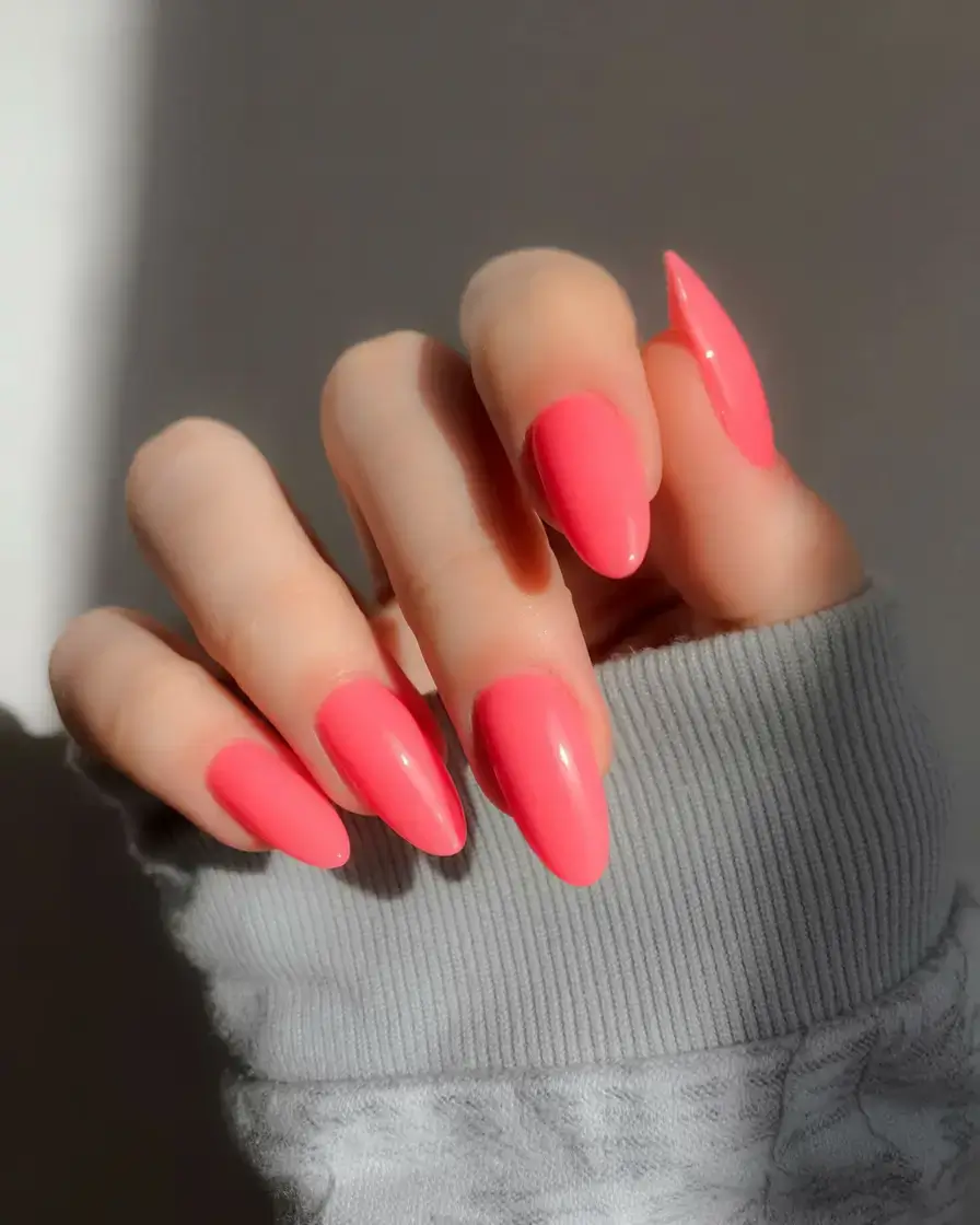 sophisticated spring long nails 2026 trends Glossy Coral Almond Nails That Brighten the Season