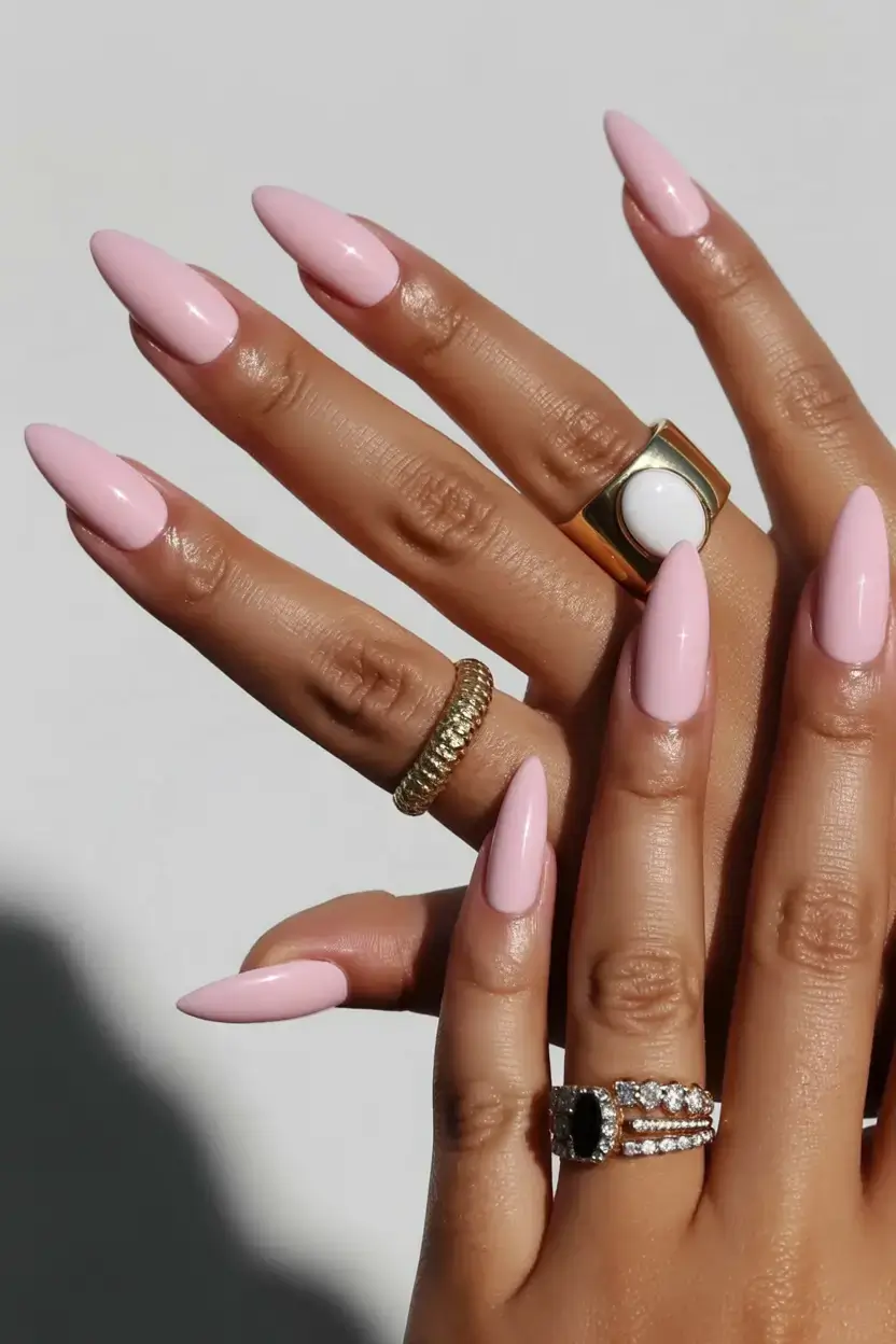 sophisticated spring long nails 2026 trends Glossy Baby Pink Almond Nails for Romantic Simplicity
