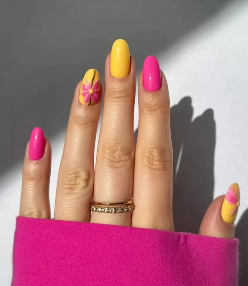 spring to summer season nail art ideas 2026 Bold Pink and Yellow Flower Power Nails