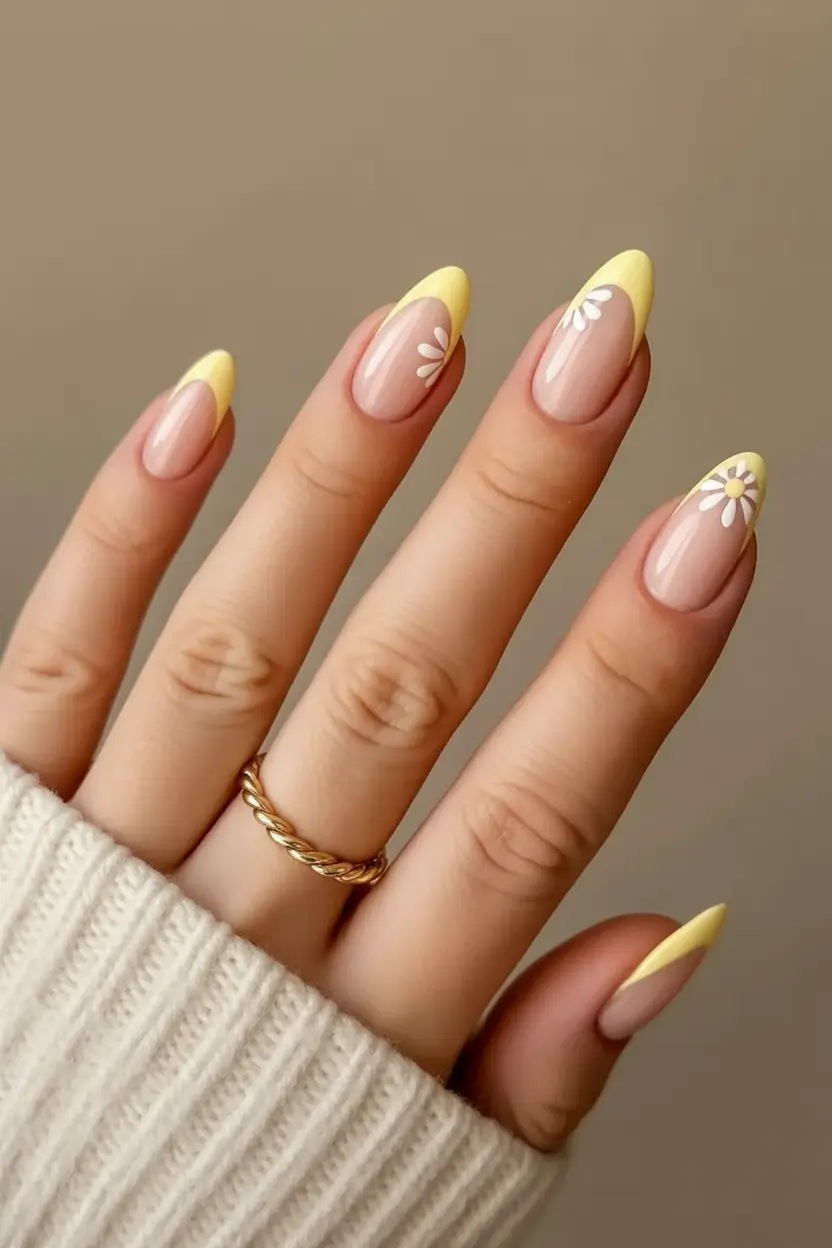 spring to summer season nail art ideas 2026 Butter Yellow French Tips with Minimal Daisy Accents