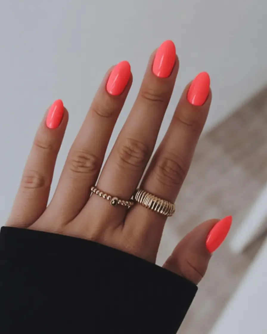 spring to summer season nails color ideas 2026 Glossy Neon Coral Nails That Capture Summer Energy