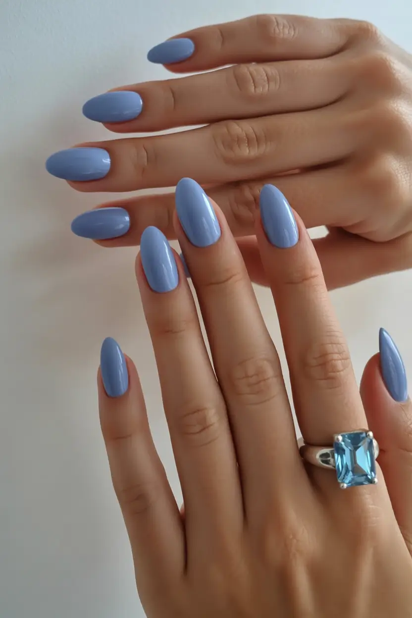 spring to summer season nails color ideas 2026 Powder Blue Oval Nails with a Soft Gloss Finish