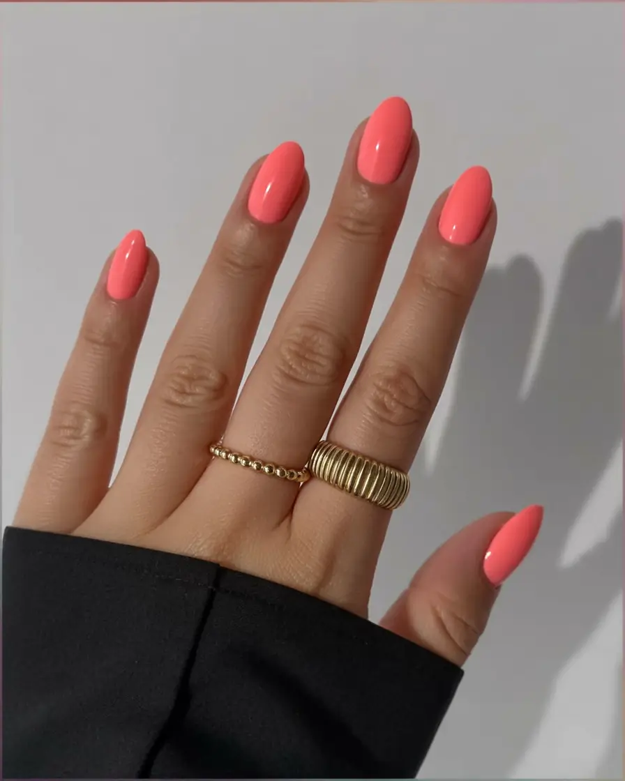 spring to summer season nails color ideas 2026 Vibrant Coral Almond Nails for the First Days of Summer