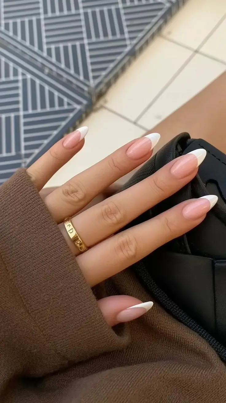 top spring nails for tan skin 2026 Modern Almond French Nails with Soft Sculpted Tips