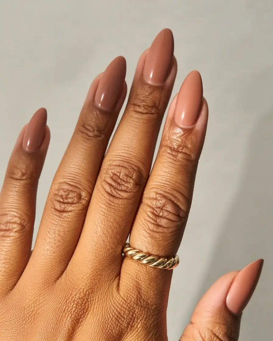 top spring nails for tan skin 2026 Warm Caramel Nude Almond Nails for a Sun-Kissed Effect