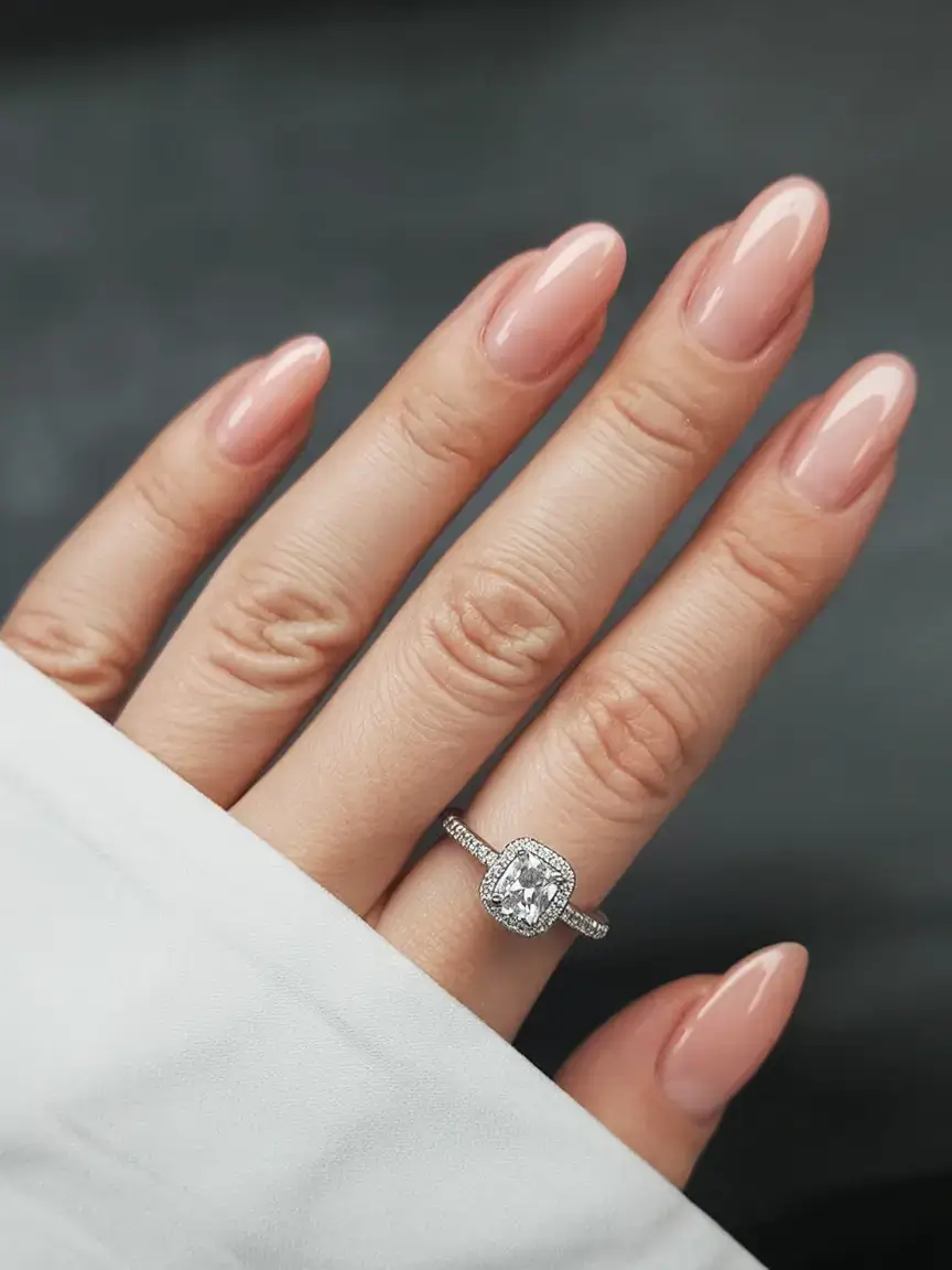 trendy spring nails 2026 for pale skin Glossy Nude Almond Nails Clean Girl Manicure