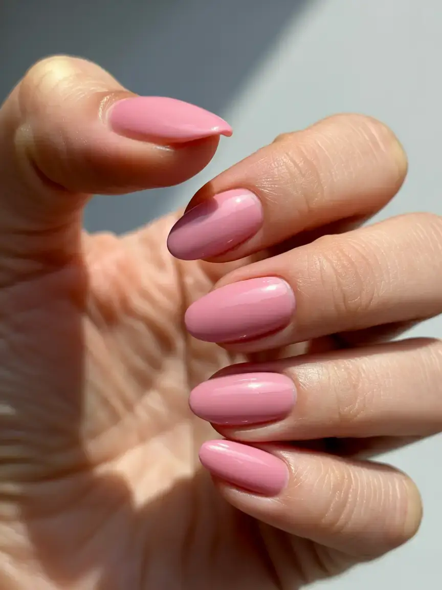 trendy spring nails 2026 for pale skin Glossy Rose Pink Almond Nails