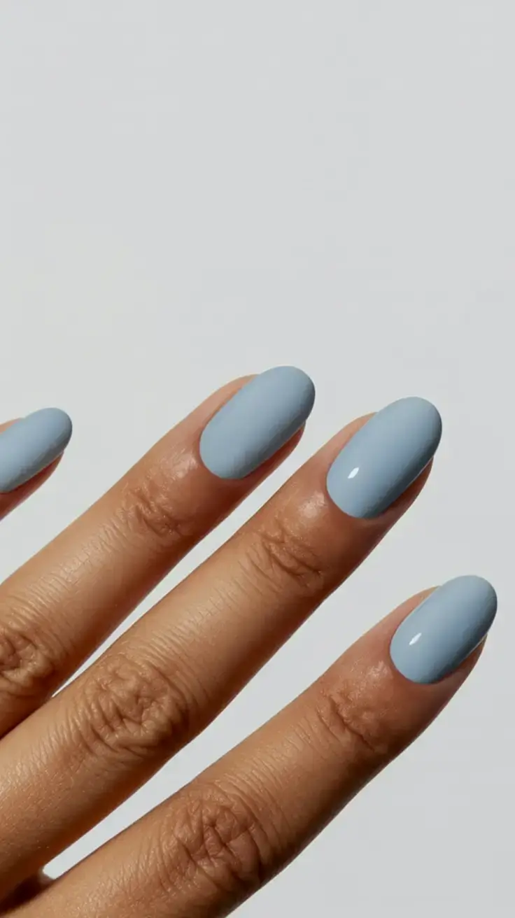 trendy spring nails 2026 for pale skin Dusty Sky Blue Almond Nails