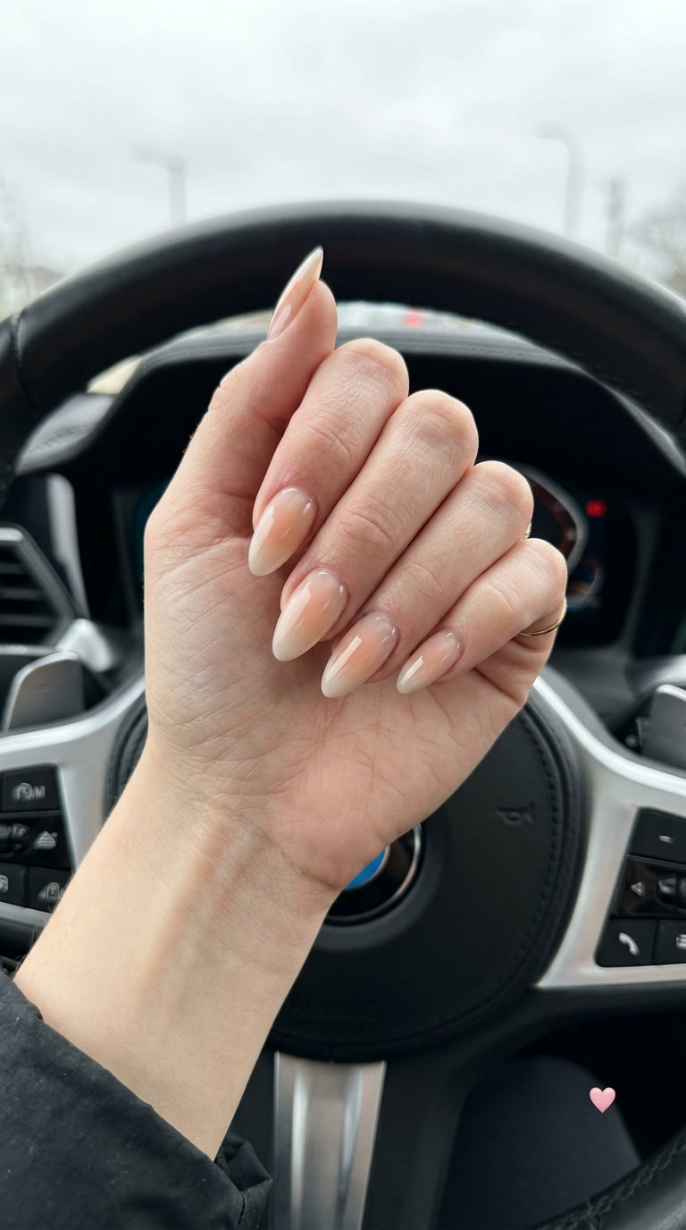 Pale Peach Aura Almond Nails 2026 Pale peach aura almond nails with sheer neutral base for fair skin, romantic glow.