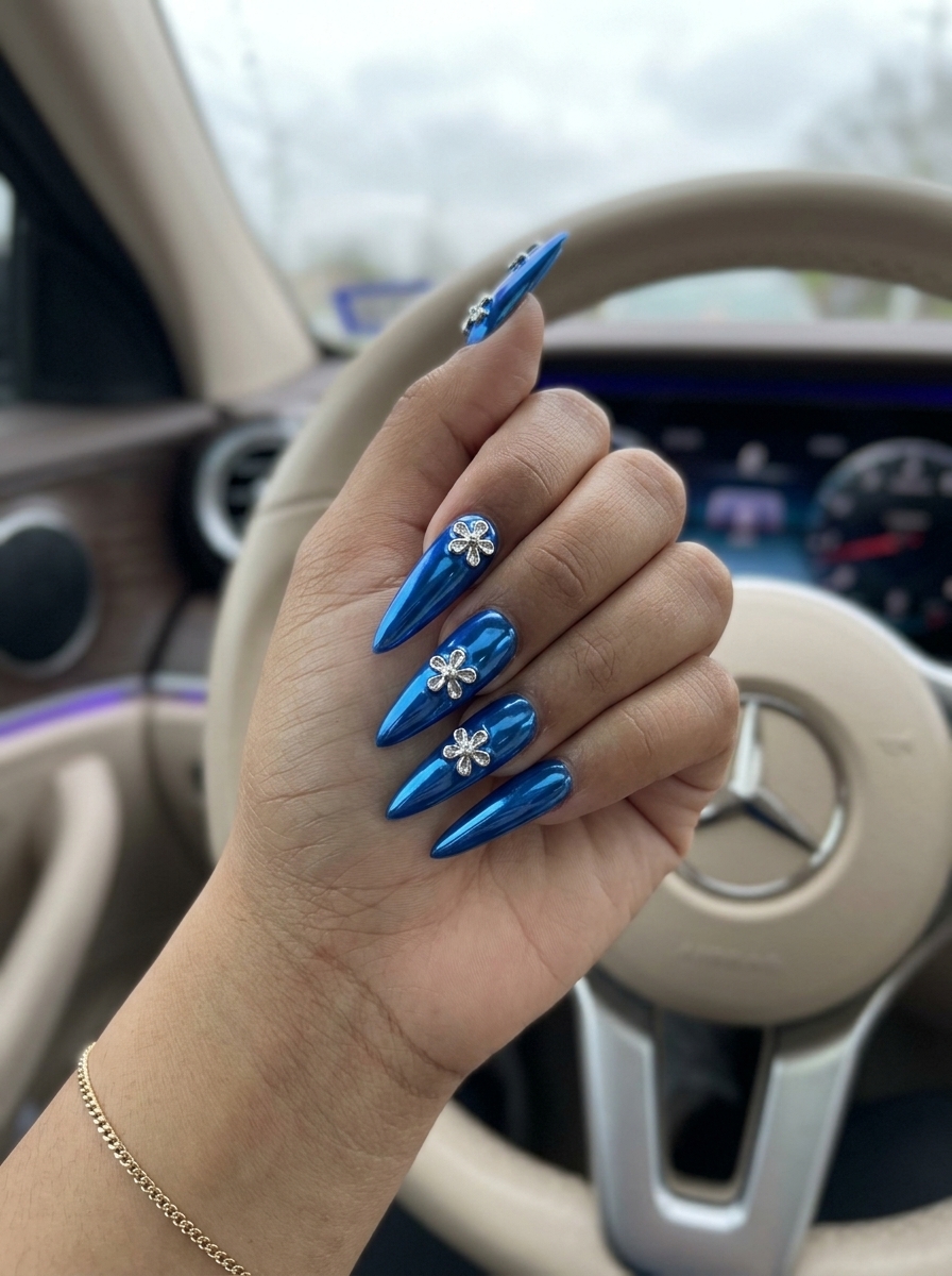 3D Chrome Flower Nails 2026: Glam Party Electric blue chrome nails with 3D flower charms for summer 2026 parties. Glamorous and futuristic.