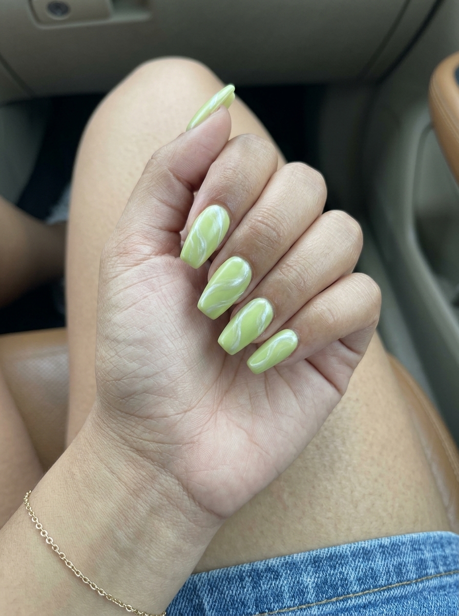 Fun Summer Nails 2026: Lime Swirl Pearl Creamy lime green nails with pearlescent white swirls for fun summer nails 2026. Perfect for casual outings.
