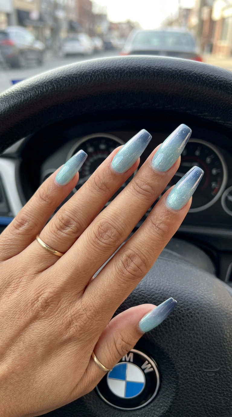 Ocean shimmer gradient blue manicure: soft blues with silver iridescent shimmer. June manicure ideas - summer trends 2026.