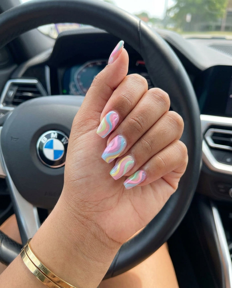 Playful pastel rainbow swirl nails in jelly finish for festivals and summer parties for June nails ideas - best for summer 2026.