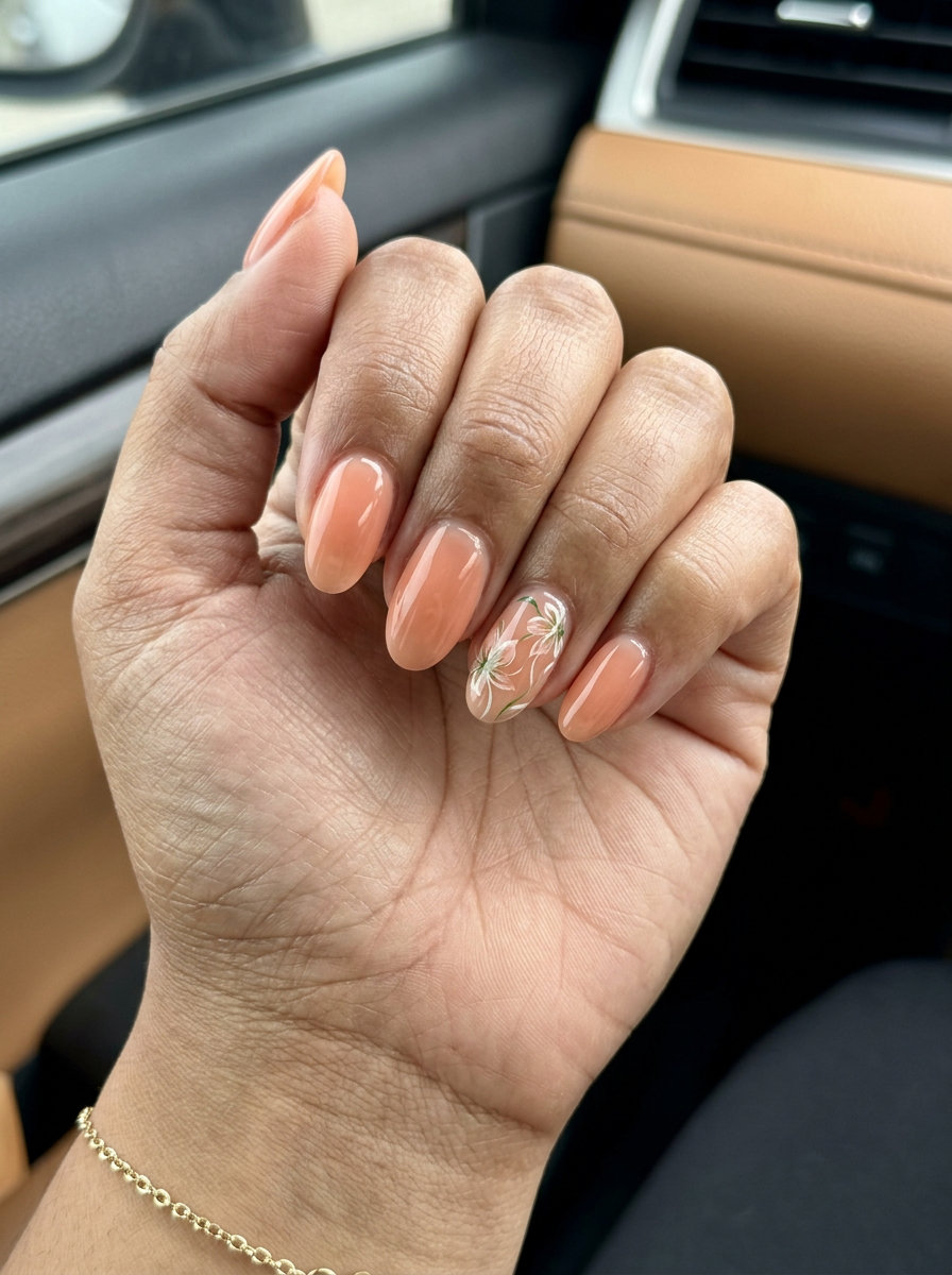 Peach Floral Oval Nails 2026 | Wedding Guest Chic Peach floral accent oval nails for wedding guests in 2026. Romantic and feminine, perfect for garden parties.