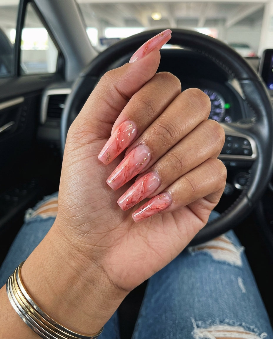Coral Pink Marble Nails 2026: Sophisticated Style Coral Pink Marble Negative Space nails for formal events, featuring warm coral pink with gold foil accents.