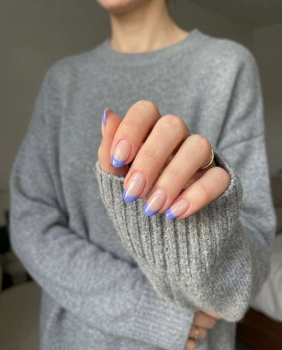 Purple Vacation Nails 2026: Periwinkle Reverse French Oval Periwinkle reverse French oval nails for vacation 2026. Sophisticated modern chic style.