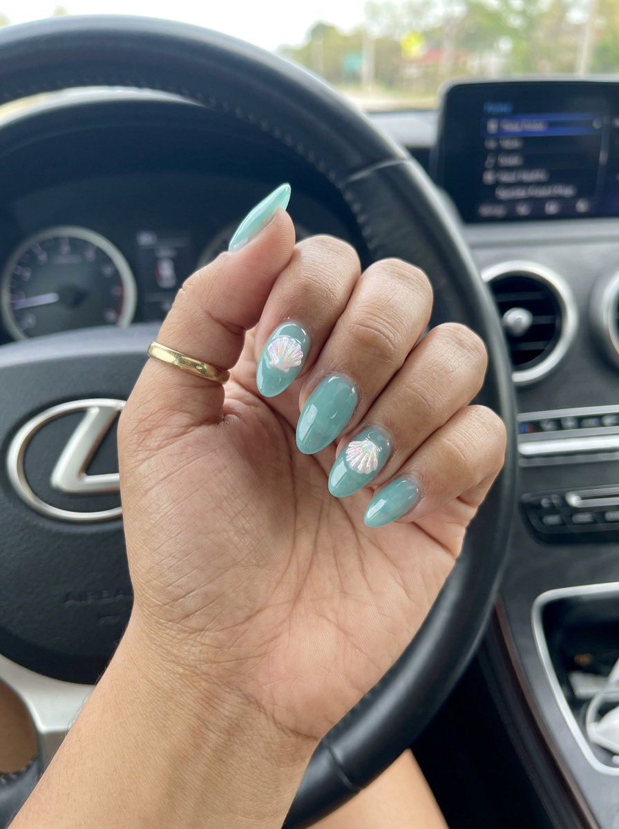 Aqua jelly seashell accent charms for shell summer nails 2026, whimsical vacation style.