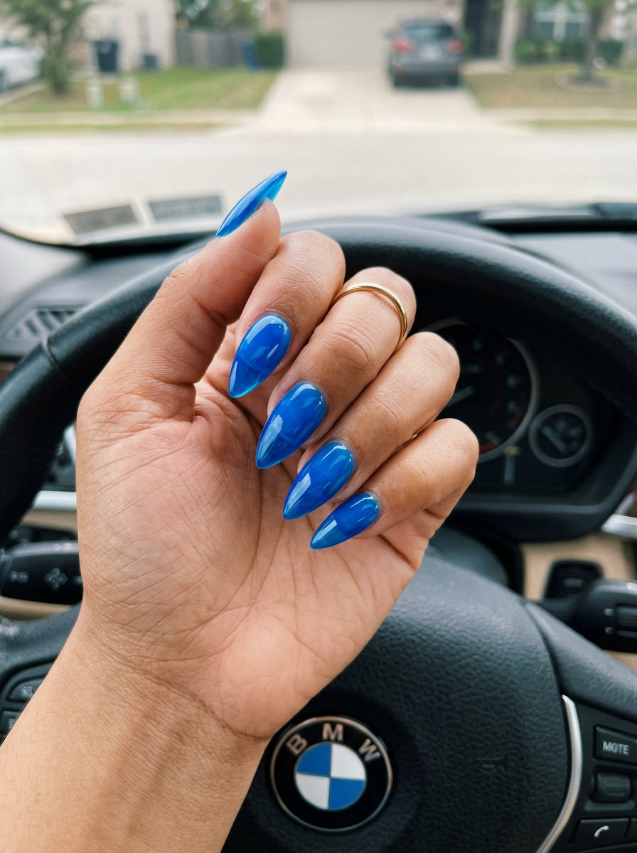 Electric Blue Jelly Stiletto Pop nails 2026: Vibrant translucent blue for playful summer festival looks.
