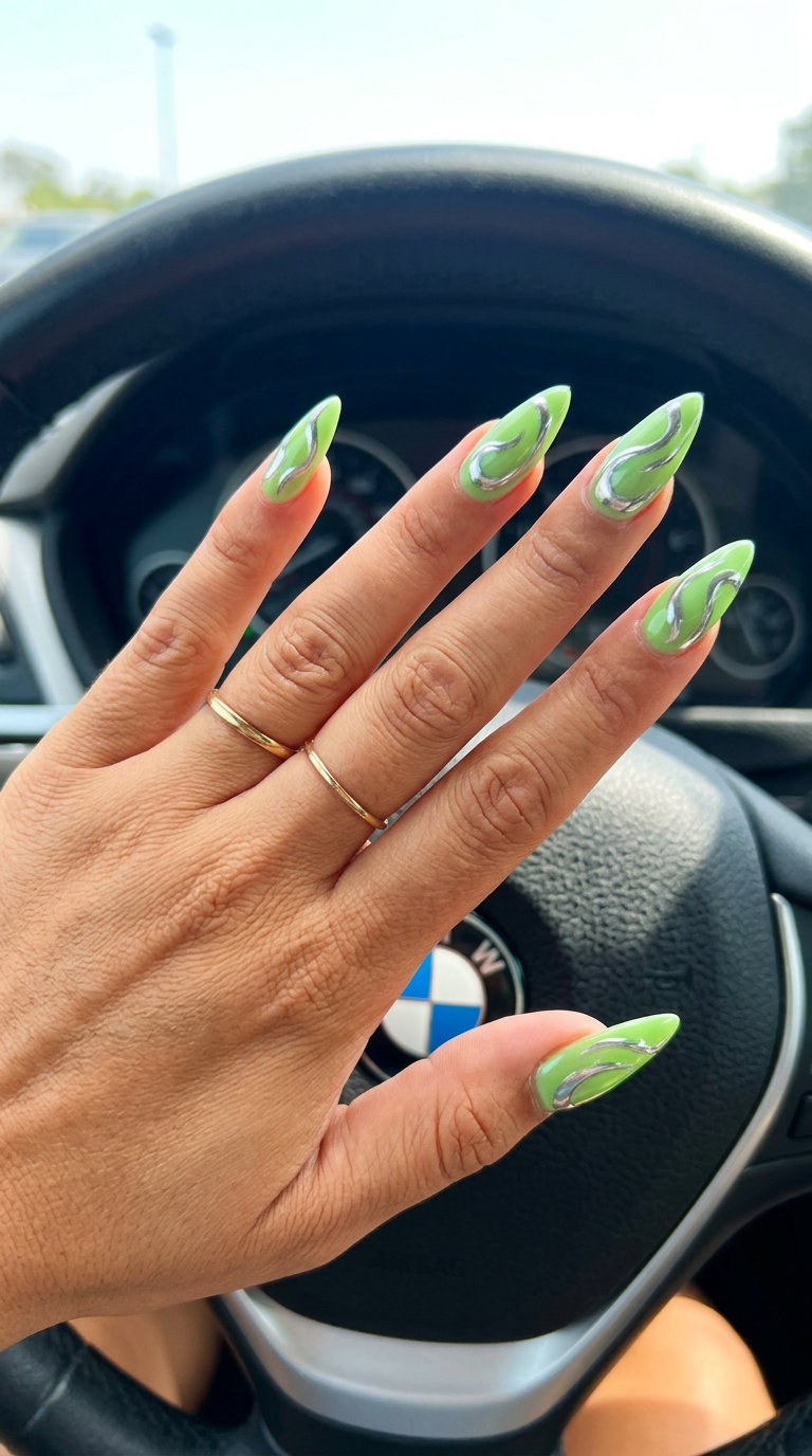 Lime Green Chrome Swirl Stiletto nails 2026: Edgy green with silver chrome swirls for night outs.