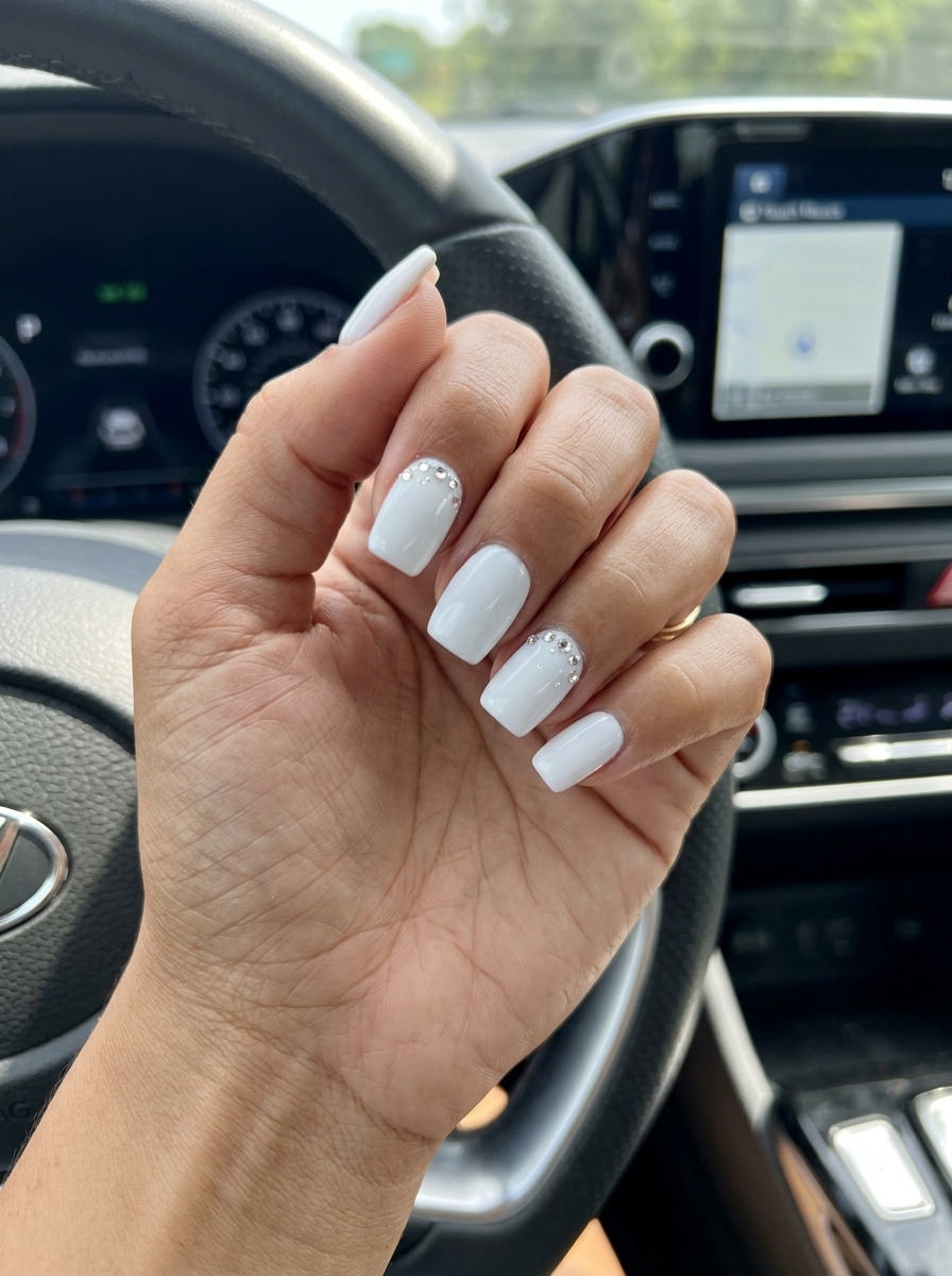Chic summer classy nails 2026: Bright white with sparkling rhinestones for parties and dinner out.