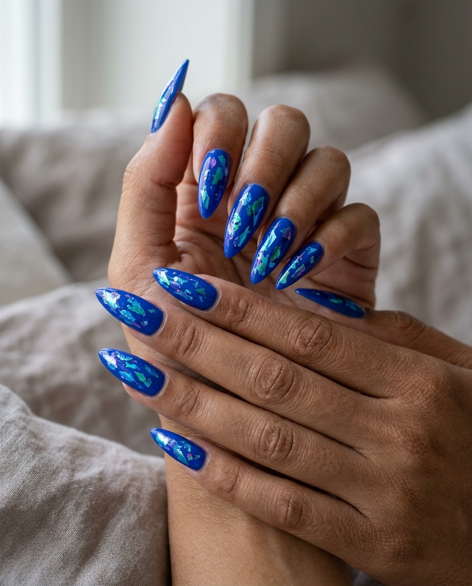 Cobalt Blue Foil Flakes Nails 2026 | Festival Glam Cobalt Blue Abstract Foil Flakes nails for summer holiday nails 2026: edgy, glamorous look for festivals or parties.