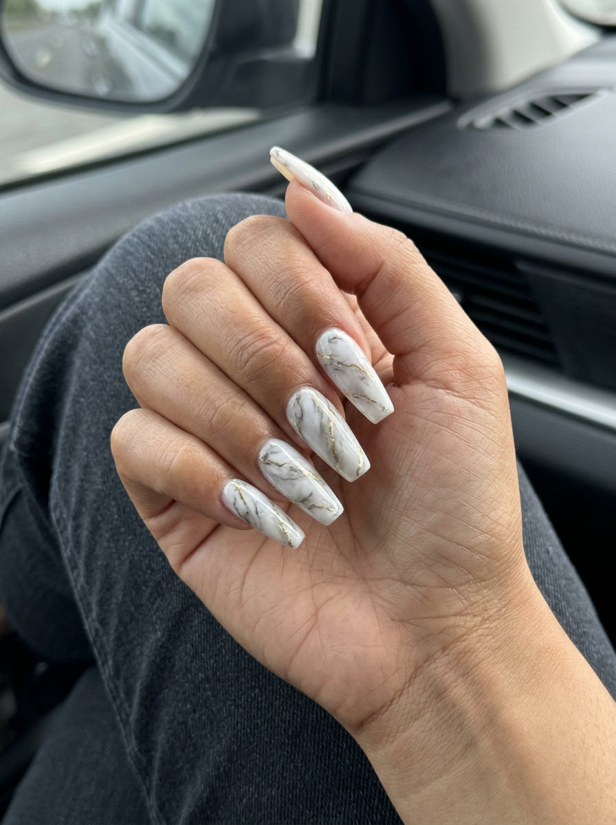 Sophisticated marble effect nails with gold veins for summer vibes nails 2026, perfect for weddings & date nights.