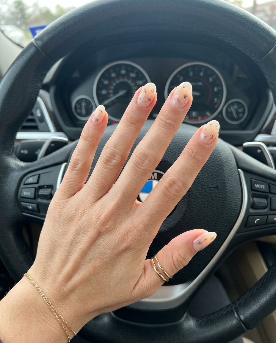 Sheer Nude Milk Bath Oval Nails 2026: Ethereal bridal & baby shower style with floral accents.